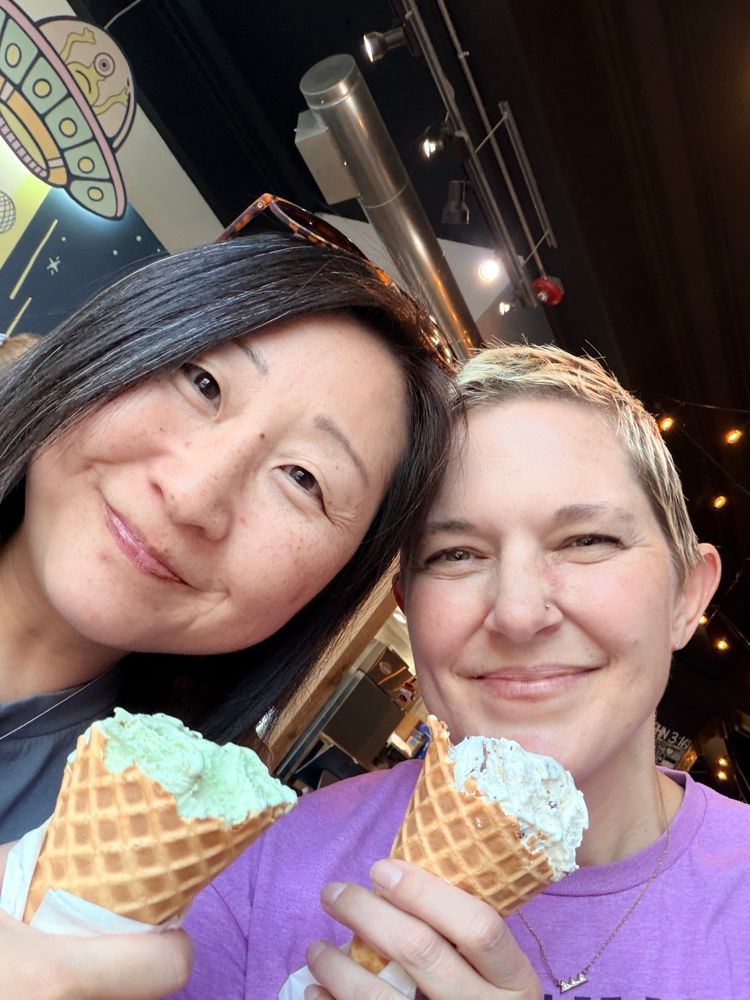 Annie and Sam sharing ice cream cones