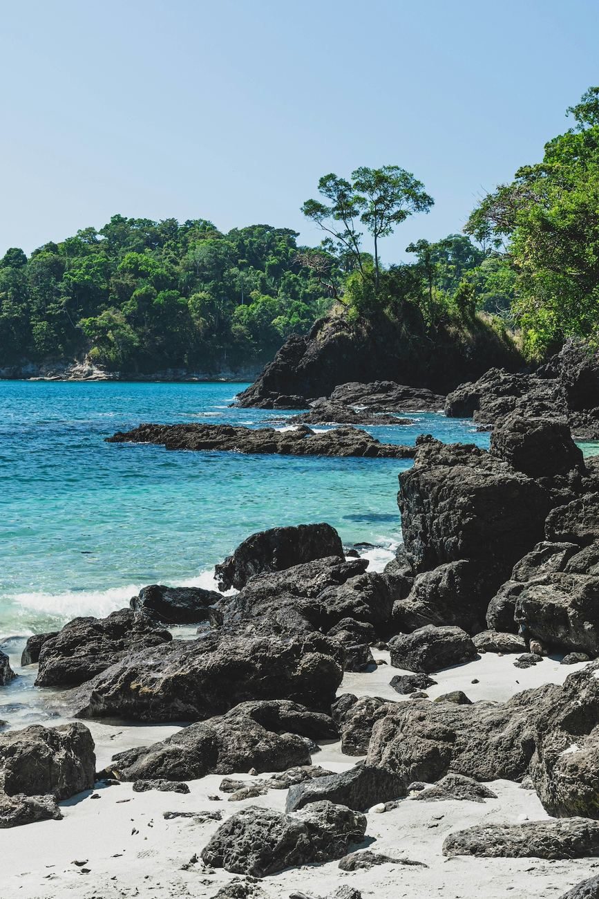 Rocky white sand cove and turquoise water on the Costa Rica coast